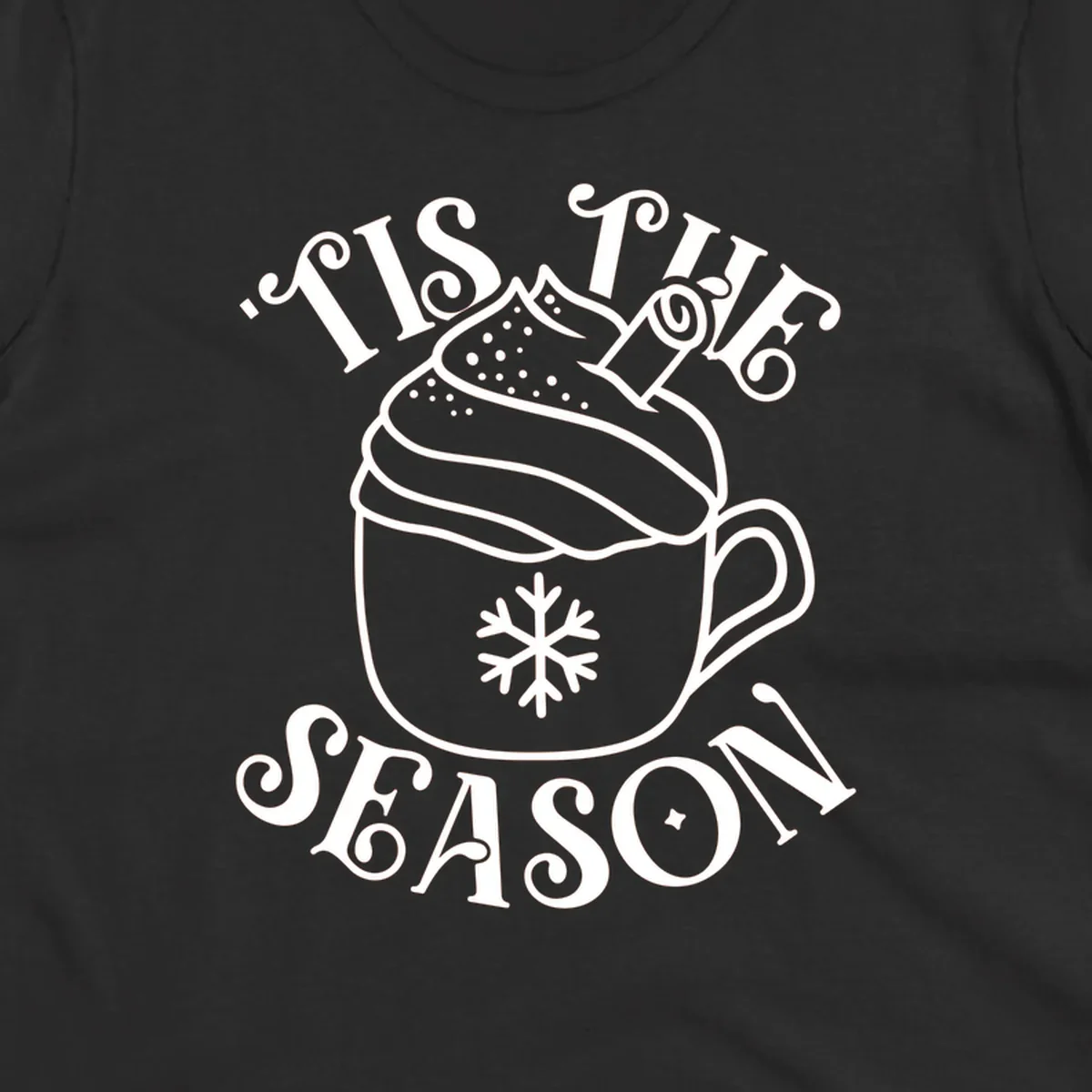 Tis the season hot cocoa mug with snowflake and cinnamon stick, white design on black.