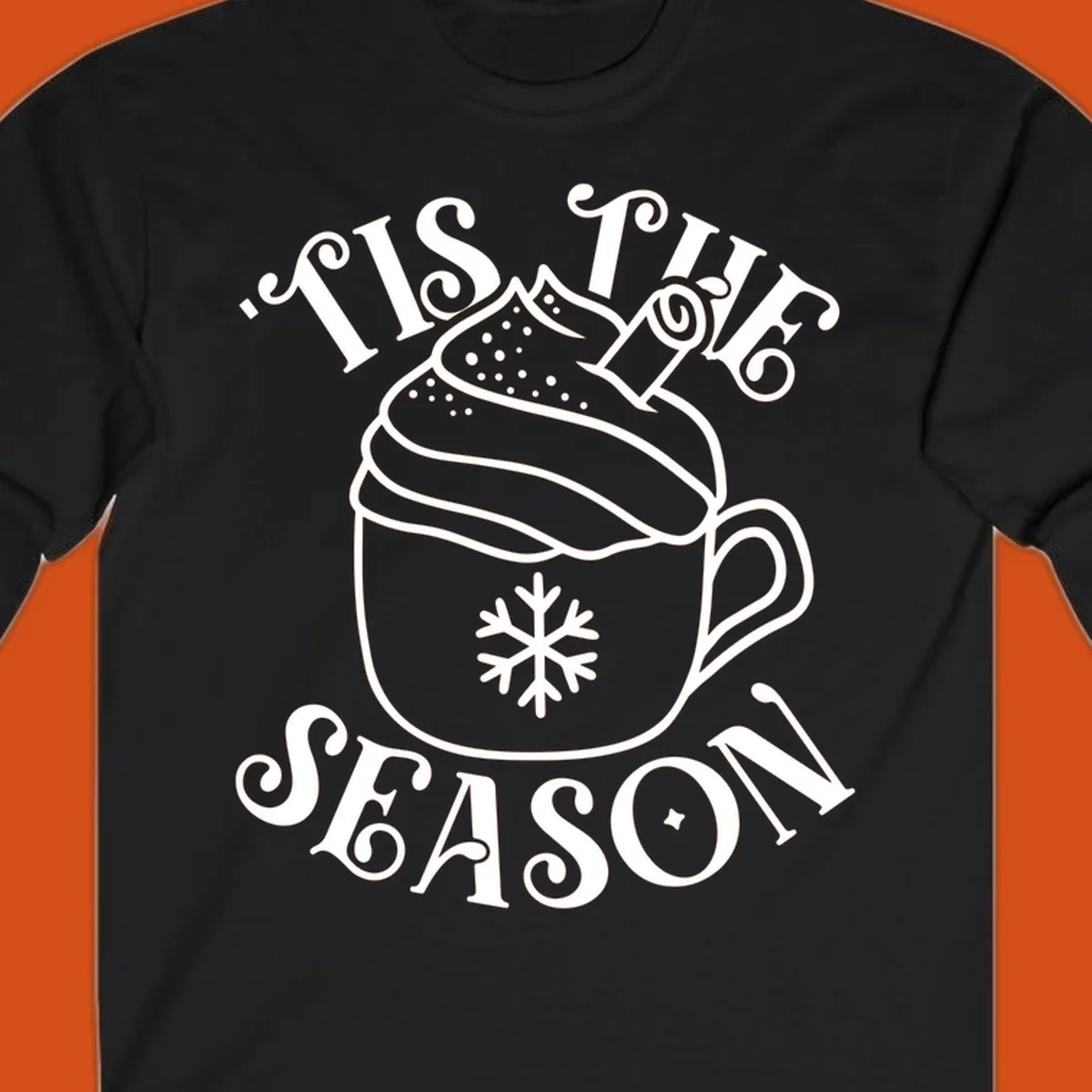 Tis the season hot cocoa mug with snowflake and cinnamon stick, white design on black.