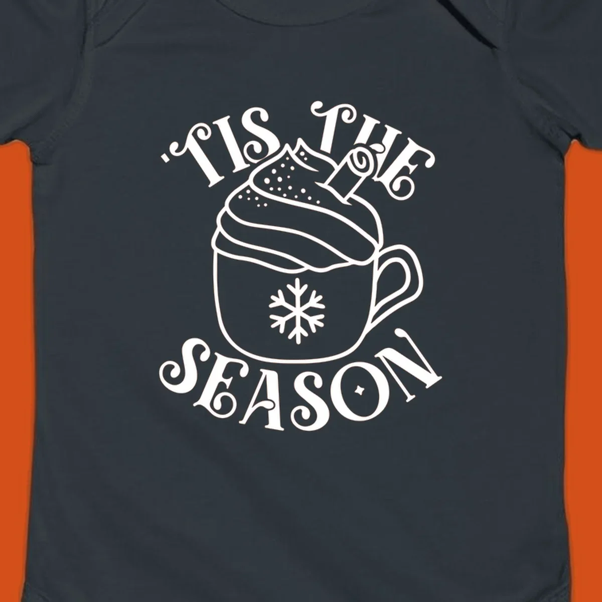 Tis the season hot cocoa mug with snowflake and cinnamon stick, white design on black.