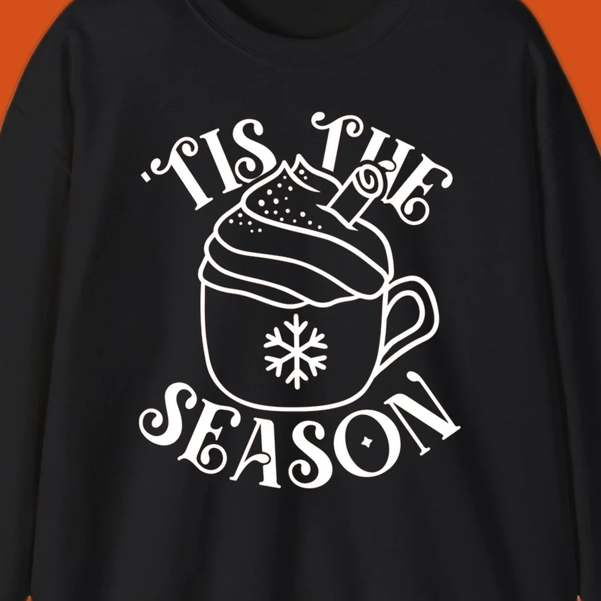 Tis the season hot cocoa mug with snowflake and cinnamon stick, white design on black.