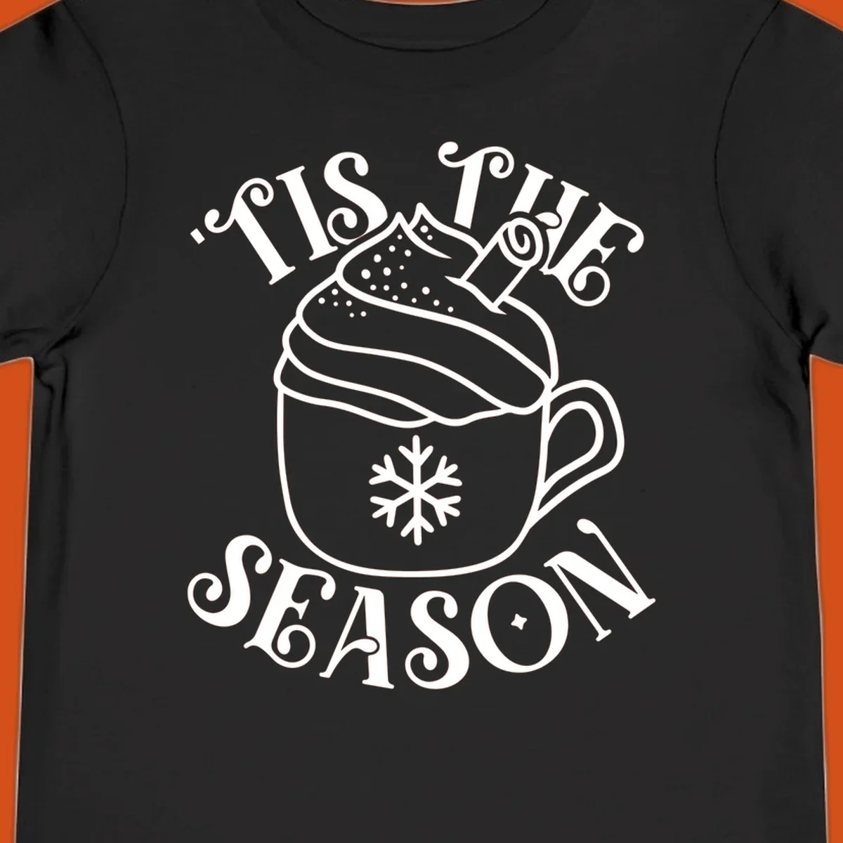 Tis the season hot cocoa mug with snowflake and cinnamon stick, white design on black.