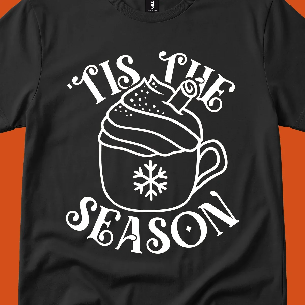 Tis the season hot cocoa mug with snowflake and cinnamon stick, white design on black.