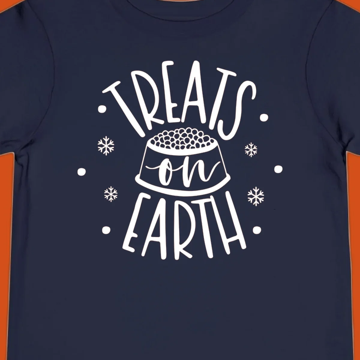 Holiday dog treats on earth text with dog bowl and snowflakes.