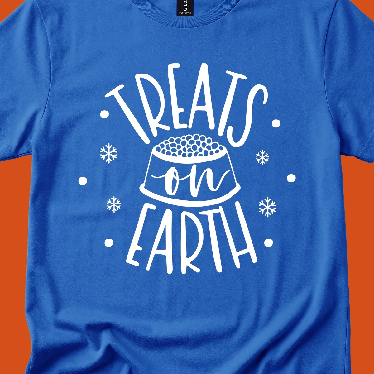 Holiday dog treats on earth text with dog bowl and snowflakes.