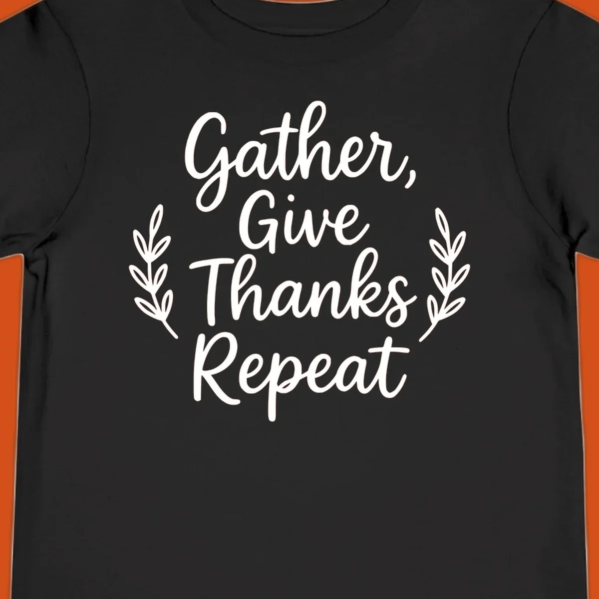 Thanksgiving gather repeat phrase in white typography with leaf accents.