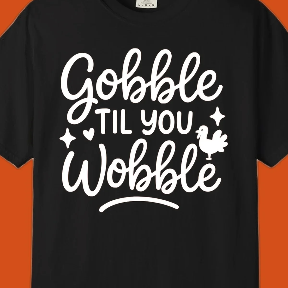 Gobble Til You Wobble Thanksgiving turkey graphic with fun lettering.