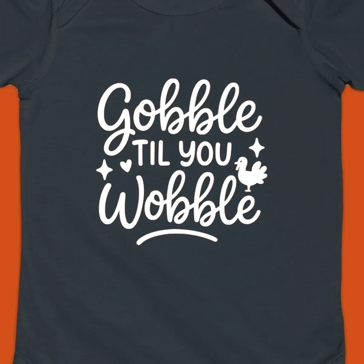 Gobble Til You Wobble Thanksgiving turkey graphic with fun lettering.
