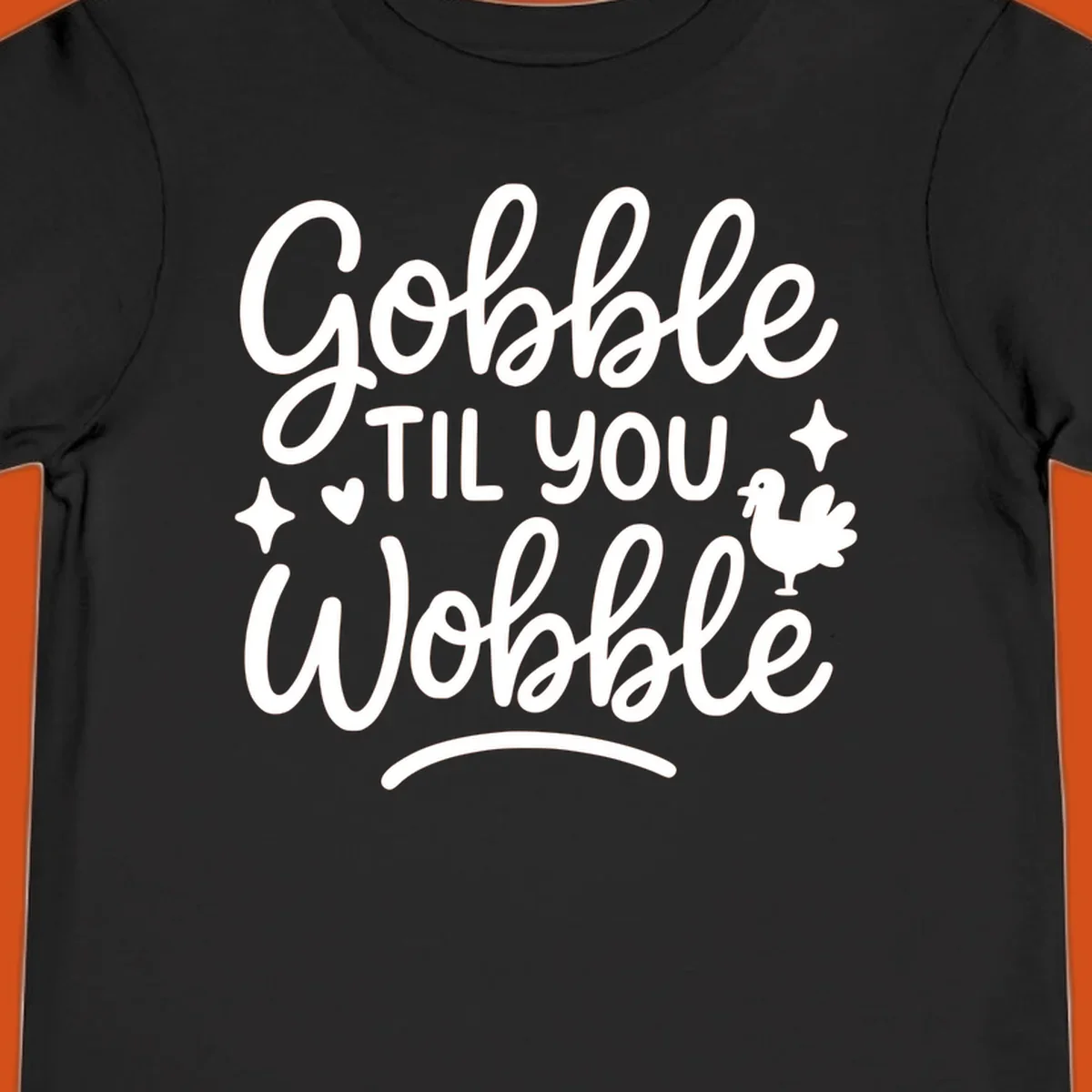Gobble Til You Wobble Thanksgiving turkey graphic with fun lettering.
