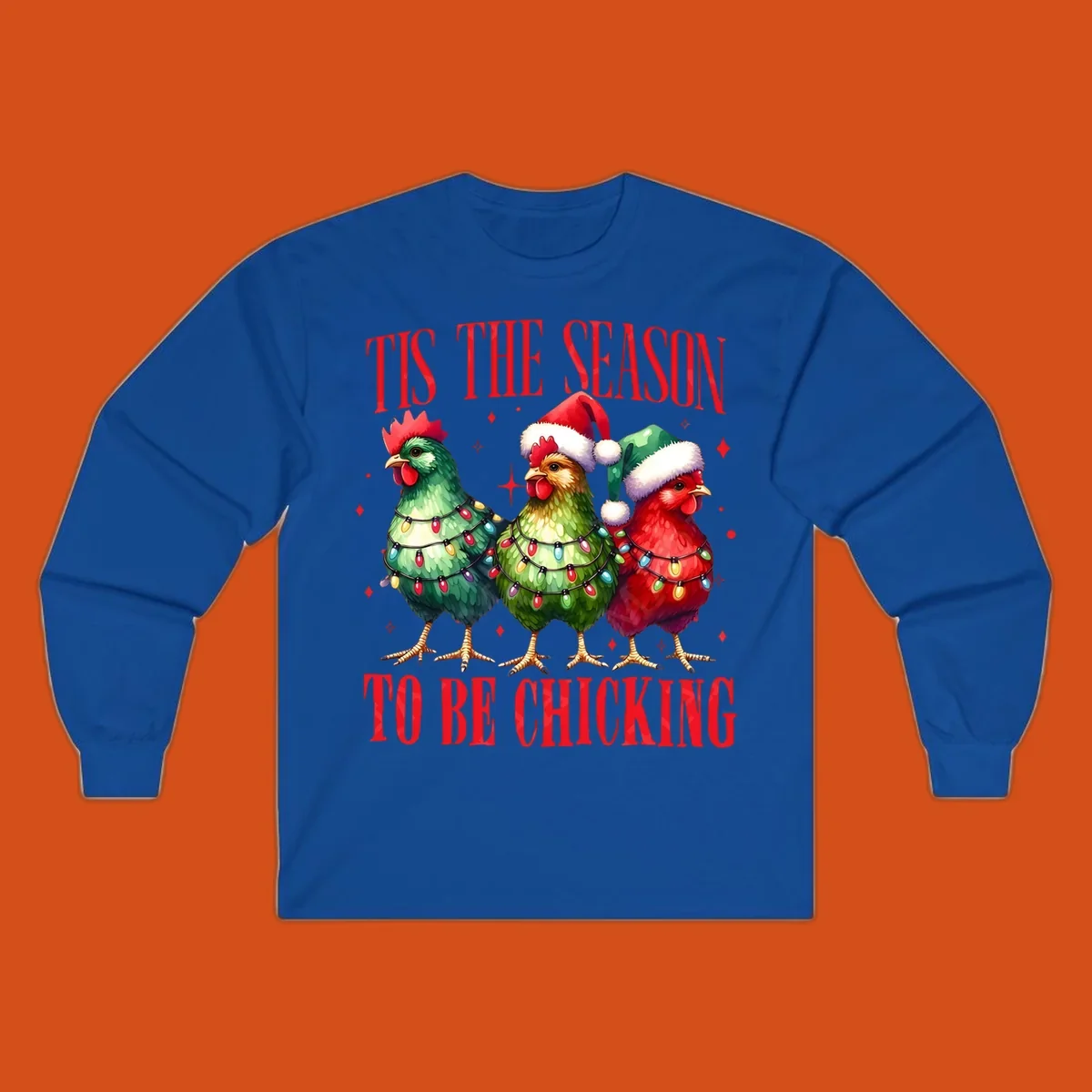 Christmas chickens wearing Santa hats and decorated with lights, with text 'Tis The Season To Be Chicking'.
