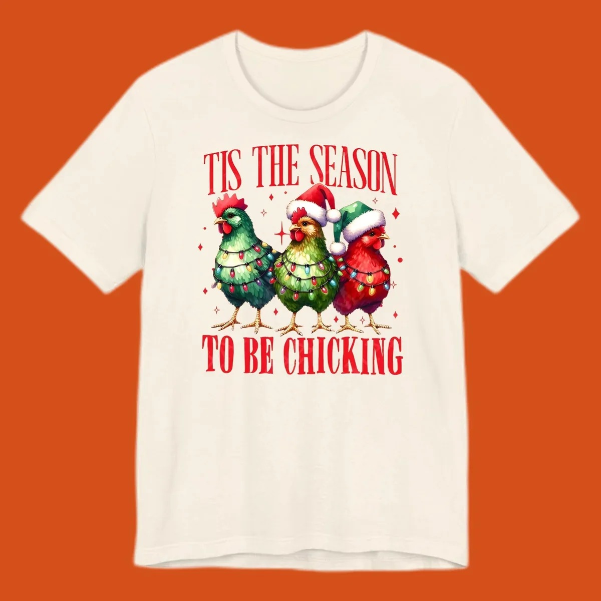 Christmas chickens wearing Santa hats and decorated with lights, with text 'Tis The Season To Be Chicking'.