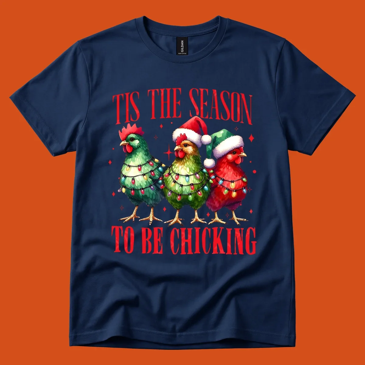 Christmas chickens wearing Santa hats and decorated with lights, with text 'Tis The Season To Be Chicking'.