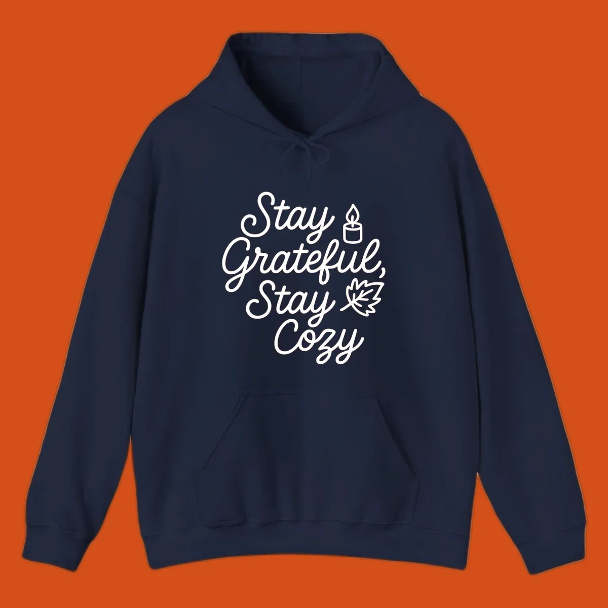 Text design with 'Stay Grateful, Stay Cozy' phrase, candle, and leaf for grateful-cozy-fall theme.