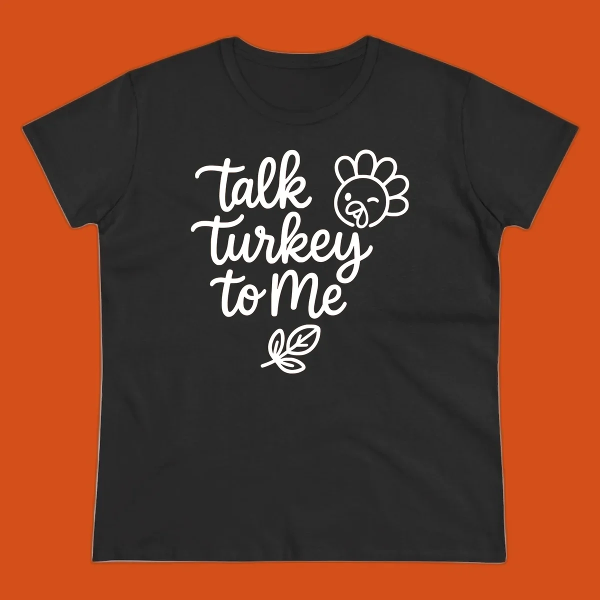 Talk Turkey To Me Thanksgiving phrase with cartoon turkey and leaf illustration.