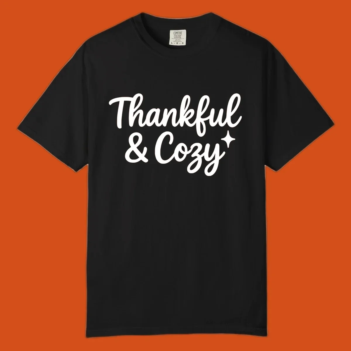 Thankful and cozy script text with starburst design.