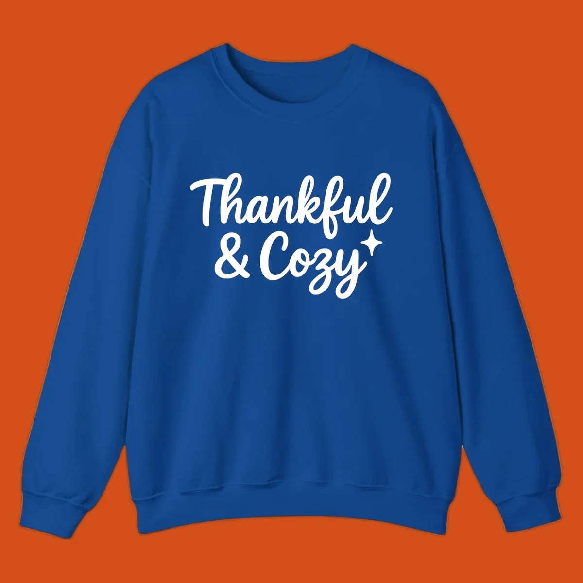 Thankful and cozy script text with starburst design.