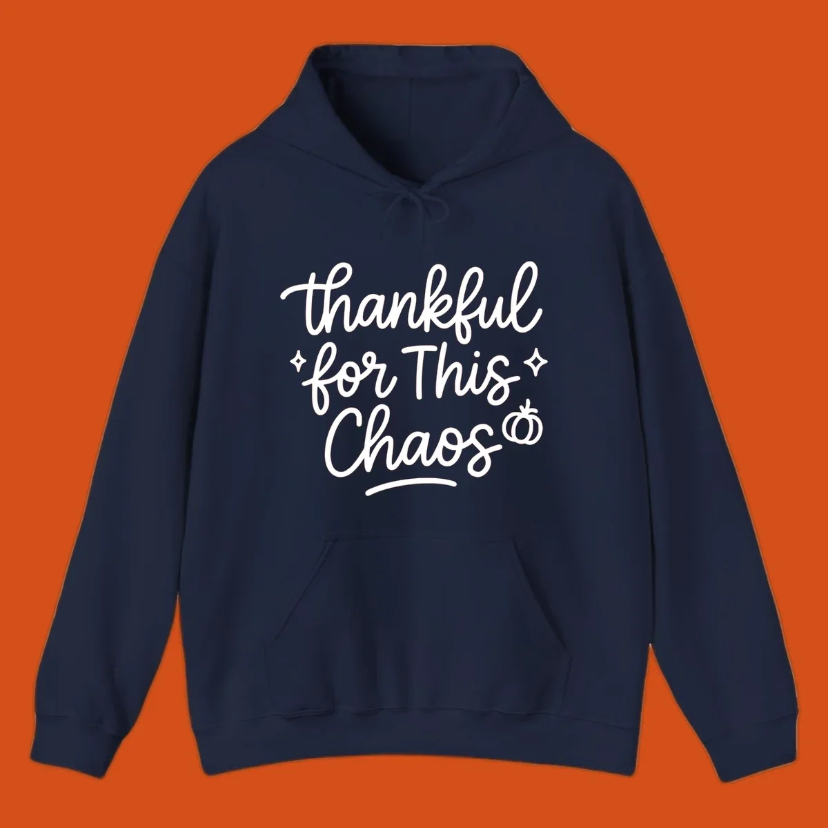 White script text 'thankful for This Chaos' with sparkles and a pumpkin on a black background.