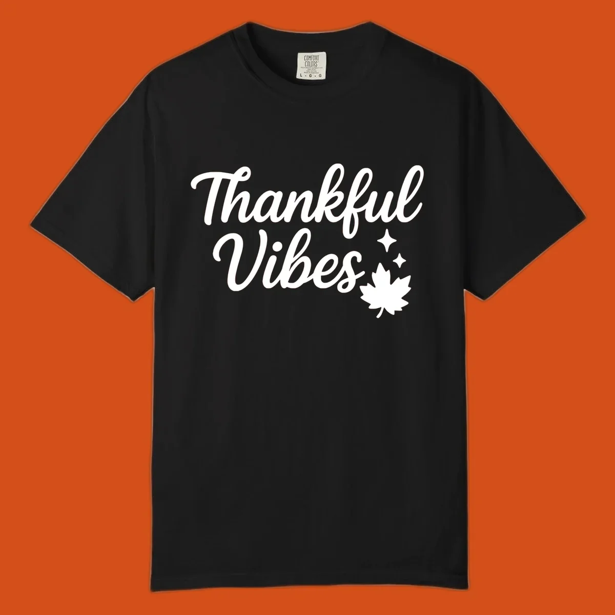 Thankful Vibes text with fall maple leaf and sparkles graphic.