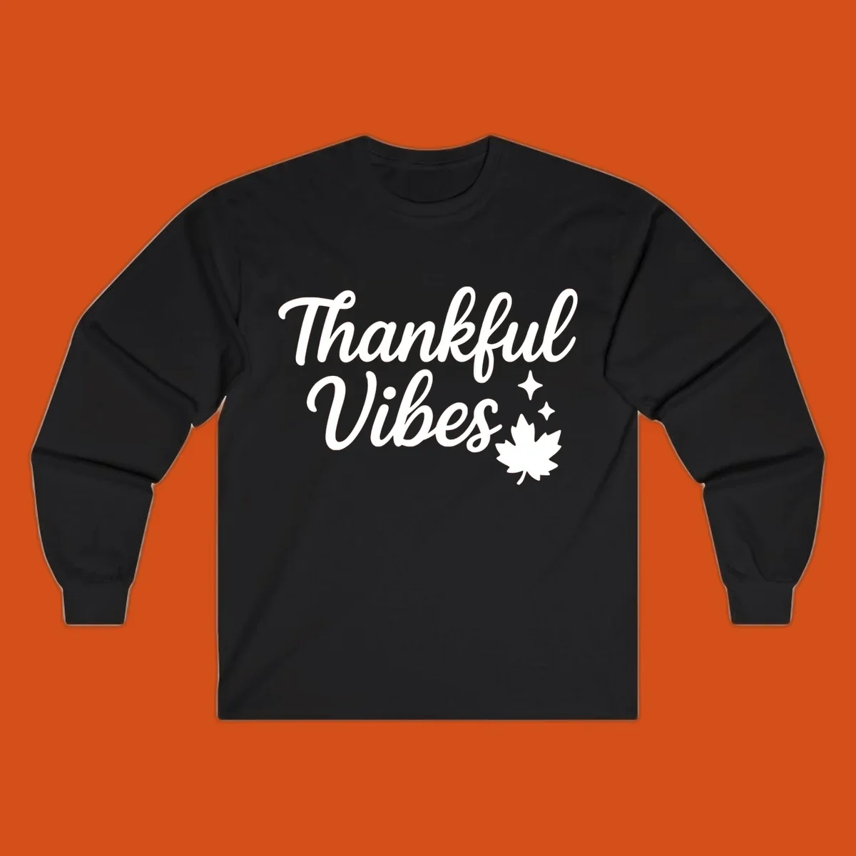 Thankful Vibes text with fall maple leaf and sparkles graphic.