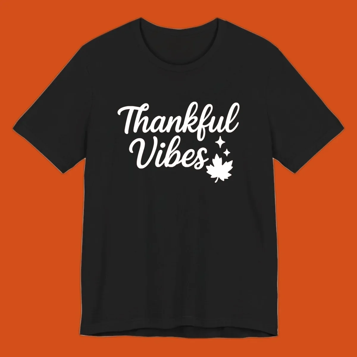 Thankful Vibes text with fall maple leaf and sparkles graphic.