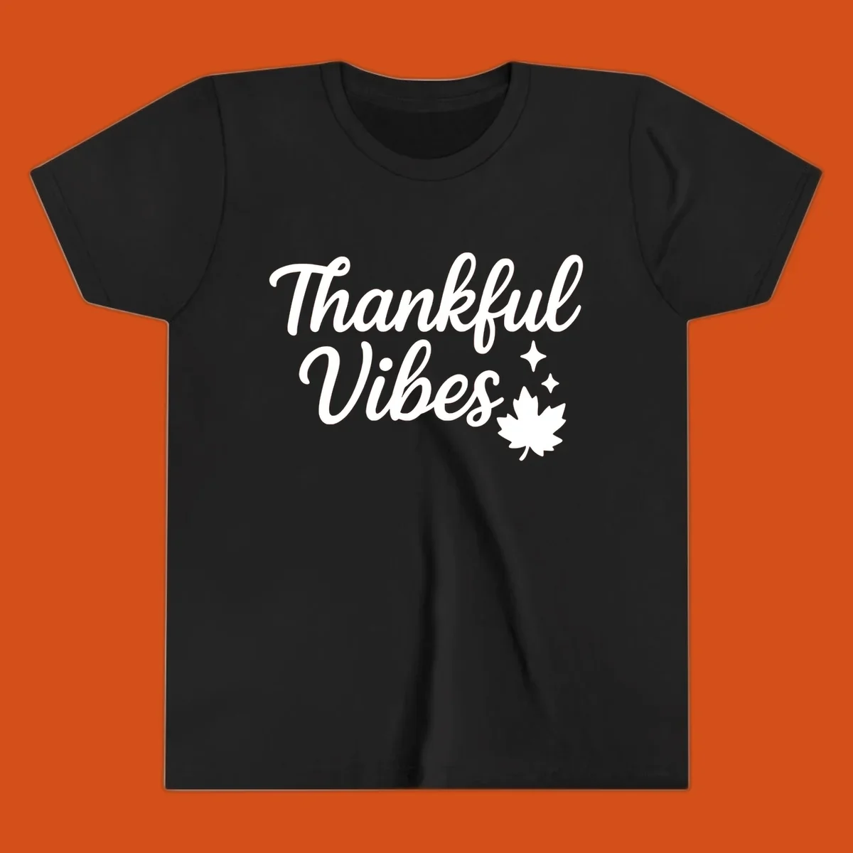 Thankful Vibes text with fall maple leaf and sparkles graphic.