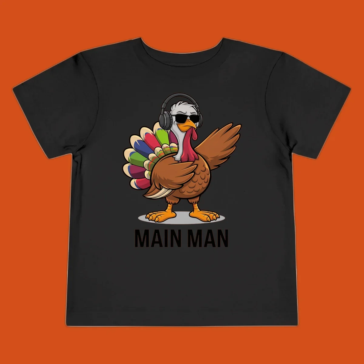Thanksgiving turkey doing a dab, wearing headphones and sunglasses, with text 'MAIN MAN'.
