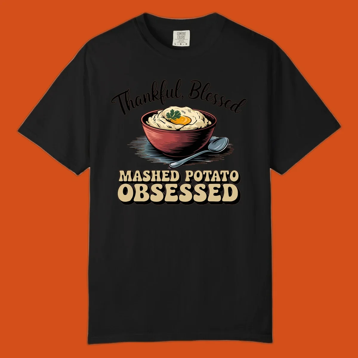 Mashed potato obsessed thankful blessed text with illustration of mashed potatoes and spoon.
