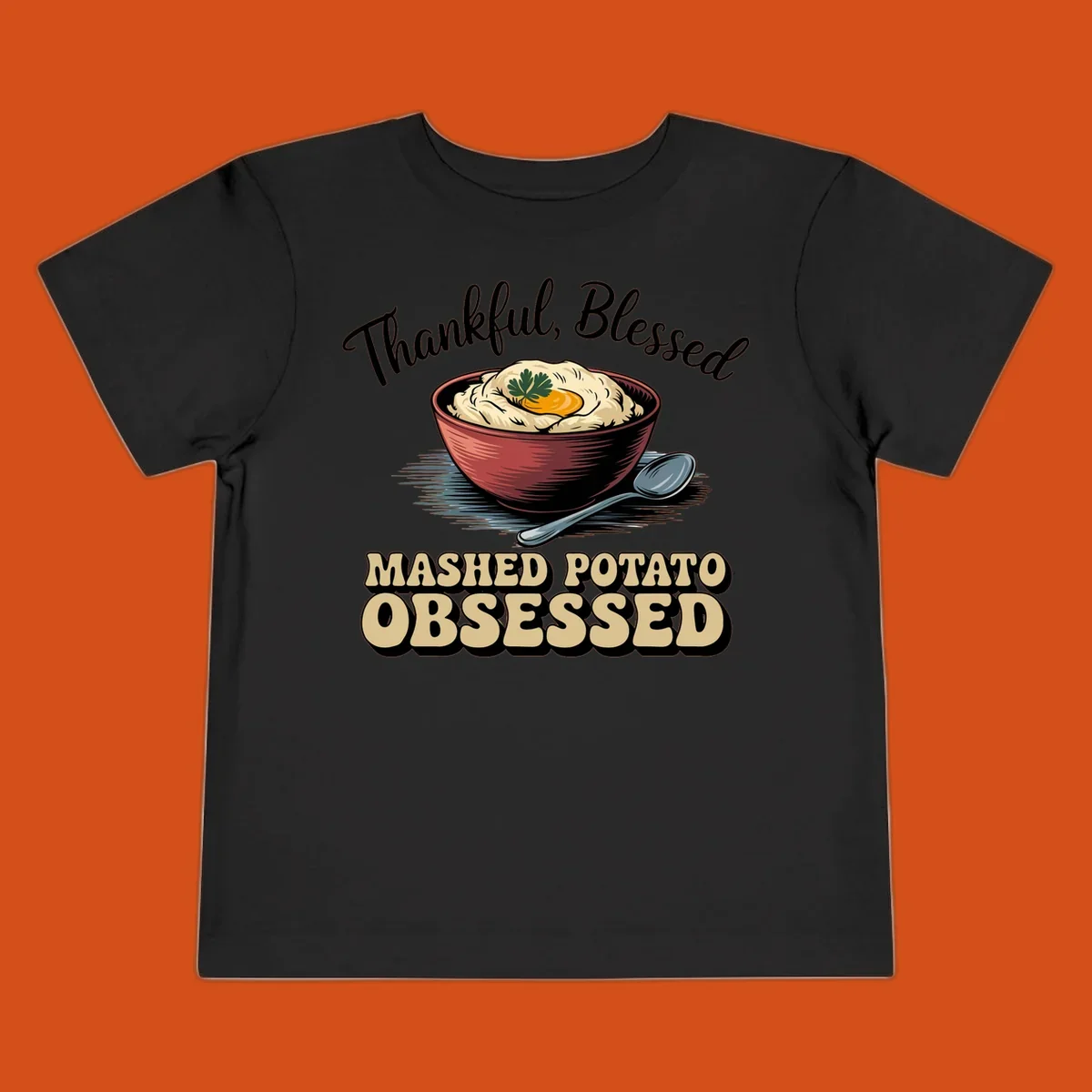 Mashed potato obsessed thankful blessed text with illustration of mashed potatoes and spoon.