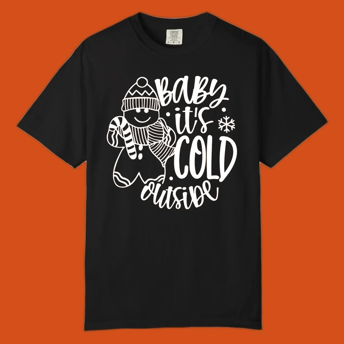 Baby it's cold outside gingerbread man with snowflake graphic.