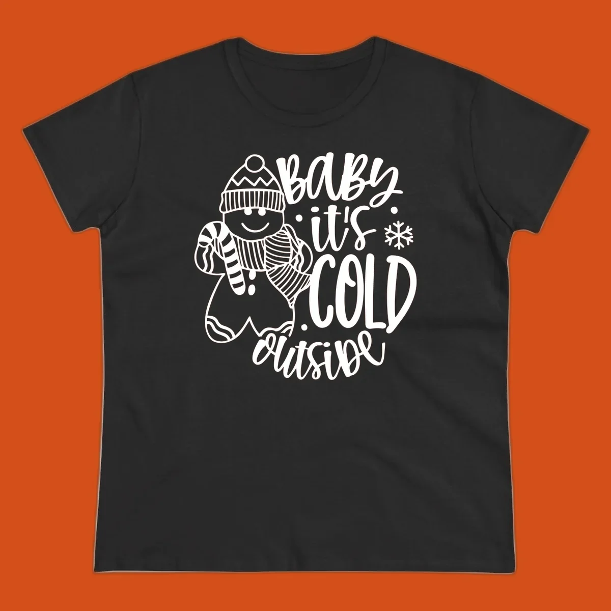 Baby it's cold outside gingerbread man with snowflake graphic.
