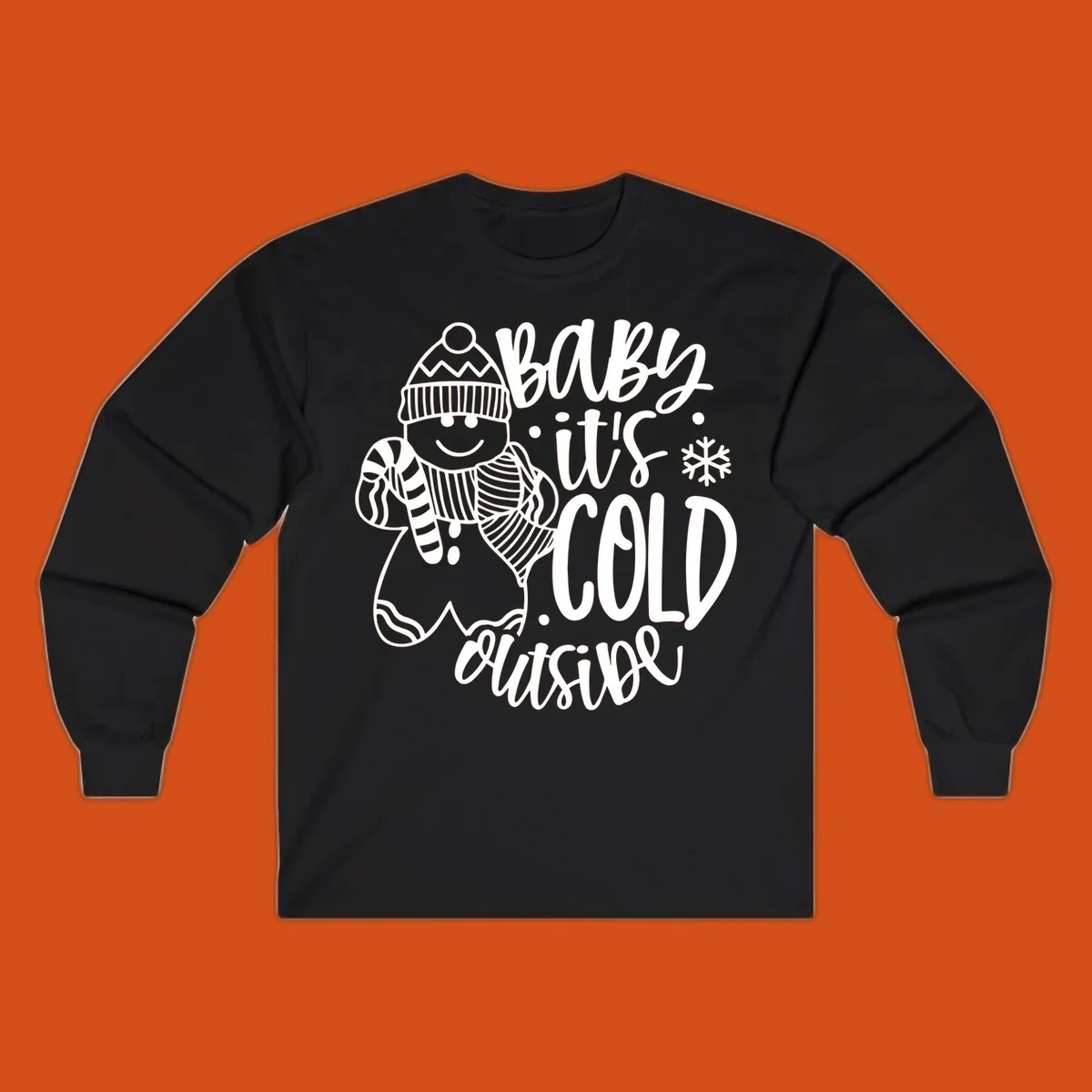 Baby it's cold outside gingerbread man with snowflake graphic.