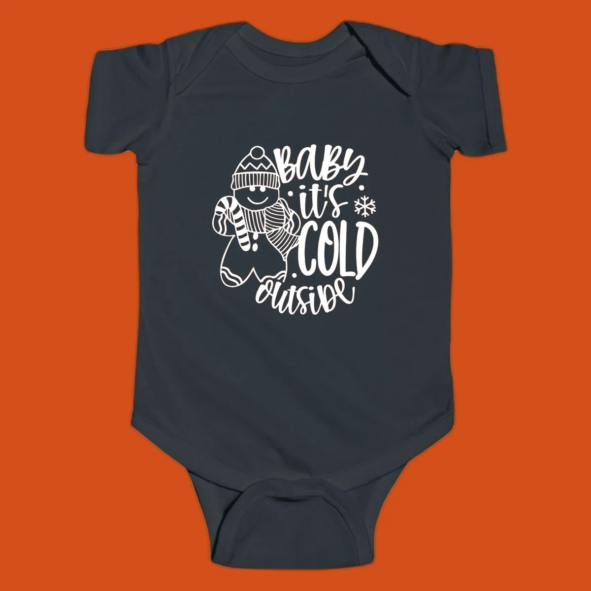 Baby it's cold outside gingerbread man with snowflake graphic.