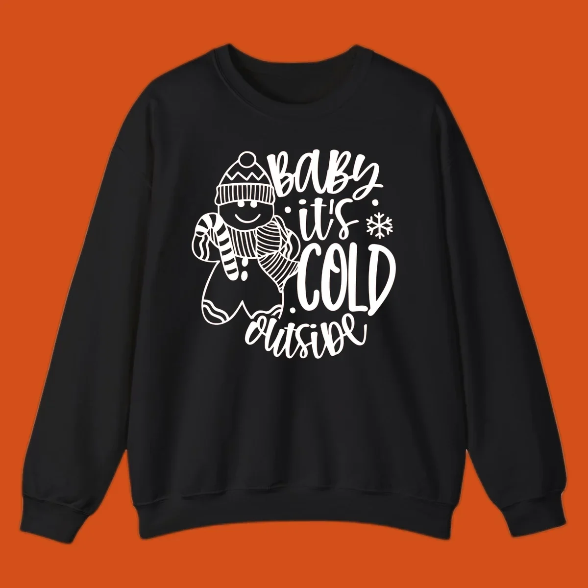 Baby it's cold outside gingerbread man with snowflake graphic.