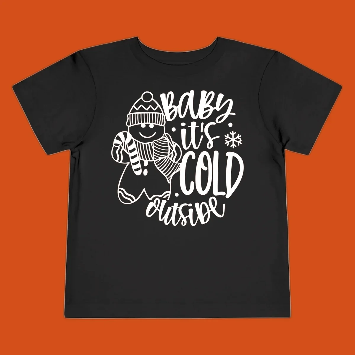Baby it's cold outside gingerbread man with snowflake graphic.