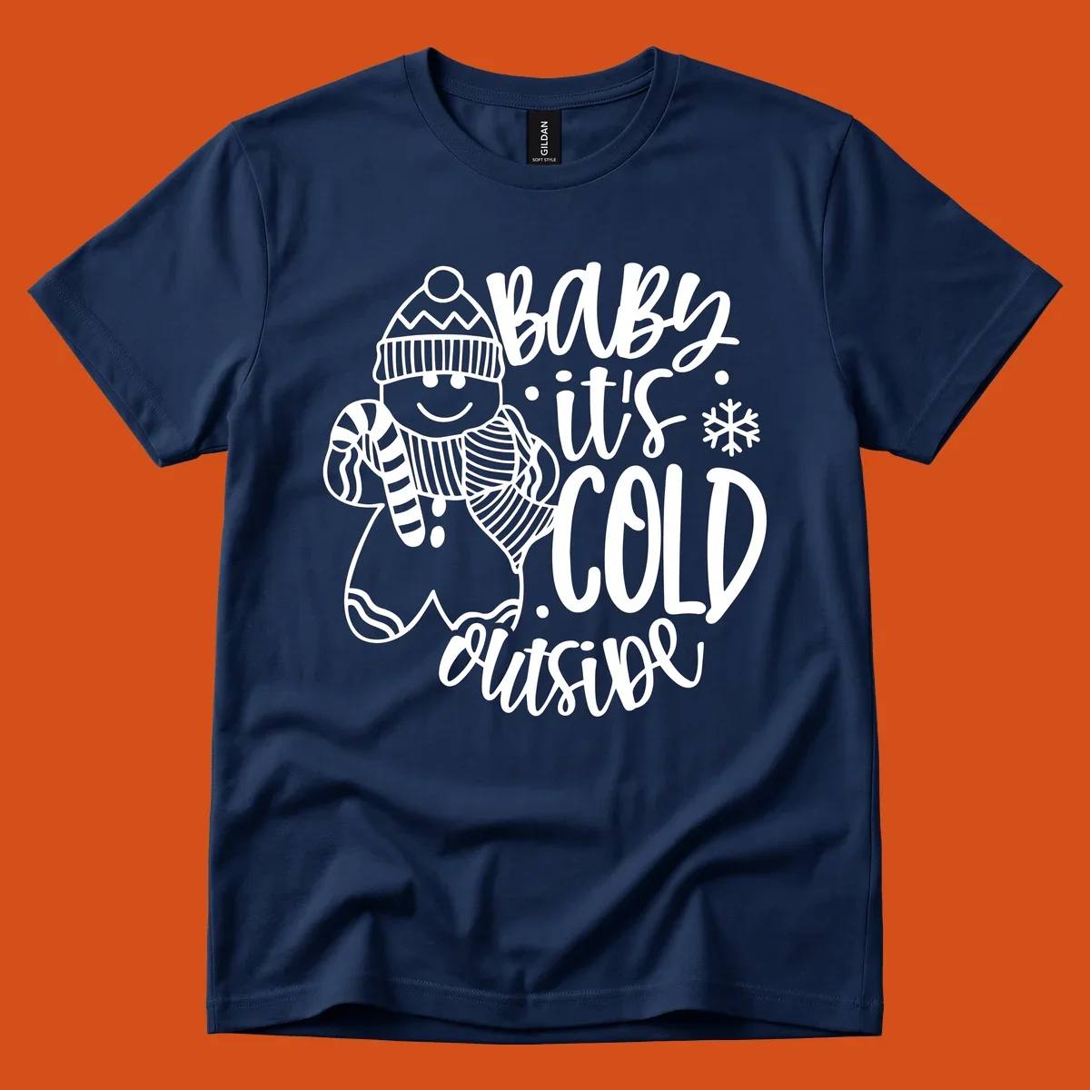 Baby it's cold outside gingerbread man with snowflake graphic.