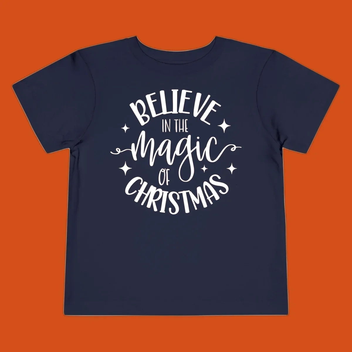 Believe in the magic of Christmas text with stars, holiday graphic.