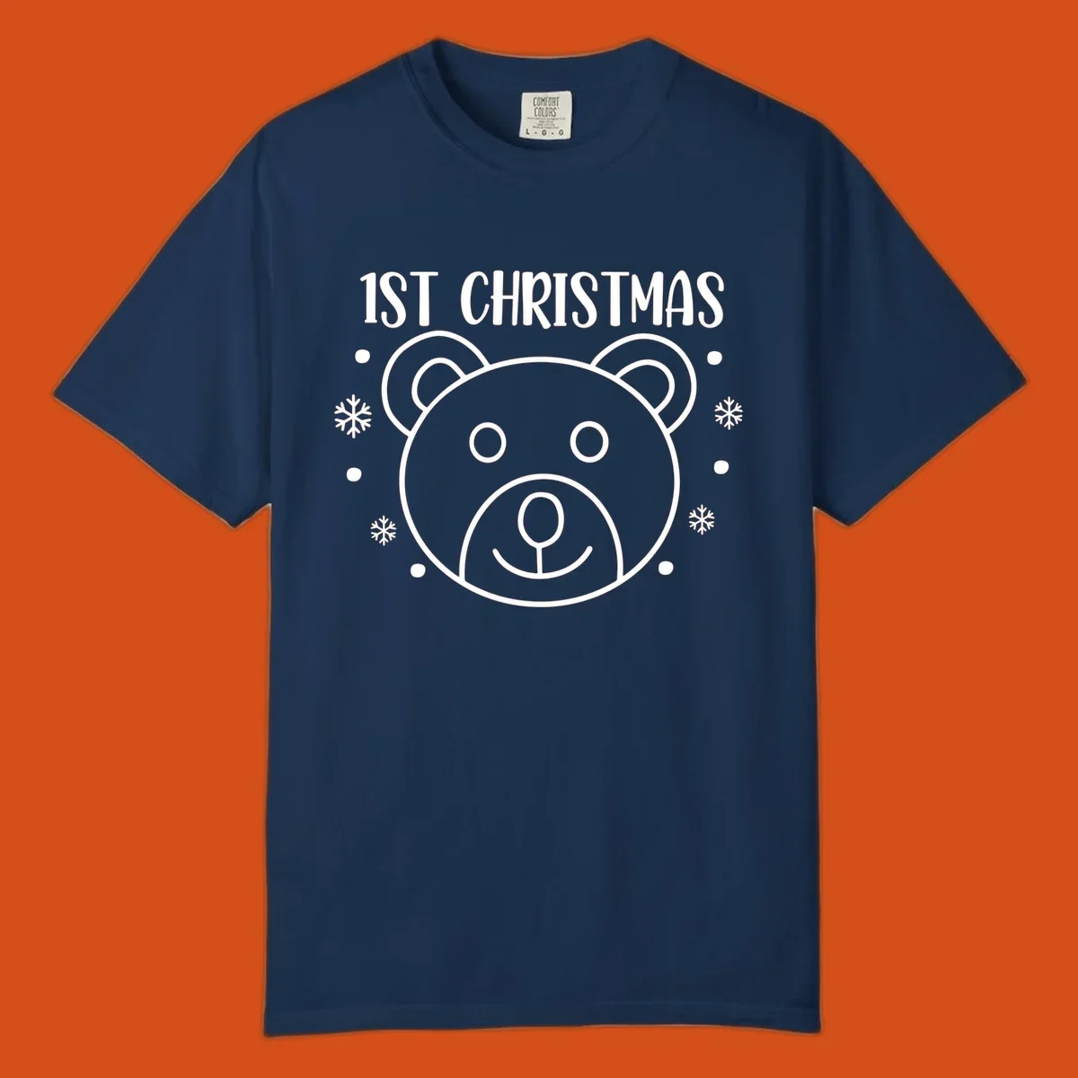 Baby's first christmas bear graphic with text and snowflakes.