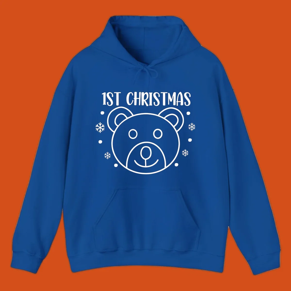 Baby's first christmas bear graphic with text and snowflakes.