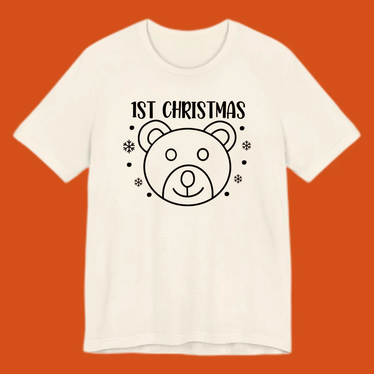 Baby's first christmas bear graphic with text and snowflakes.