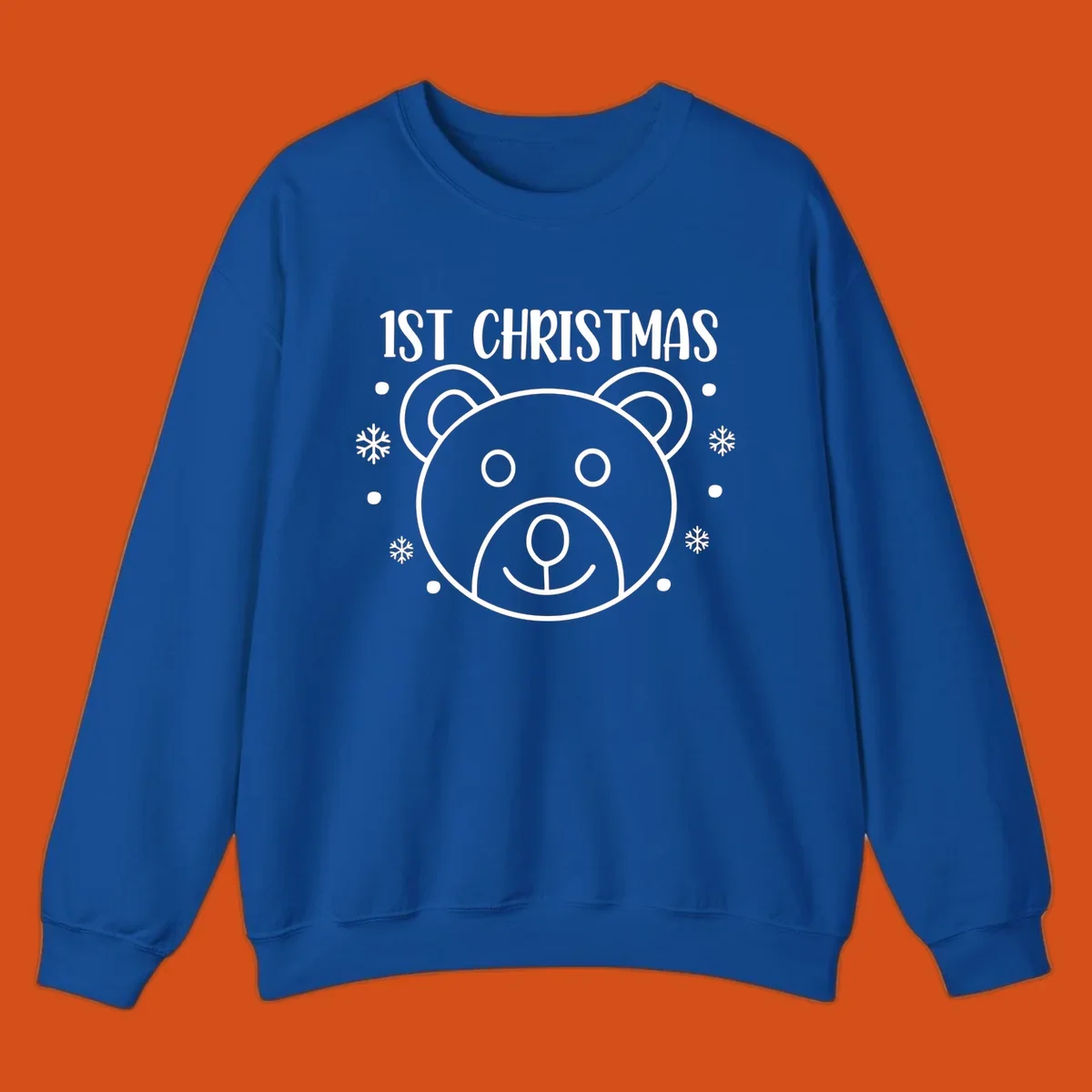 Baby's first christmas bear graphic with text and snowflakes.