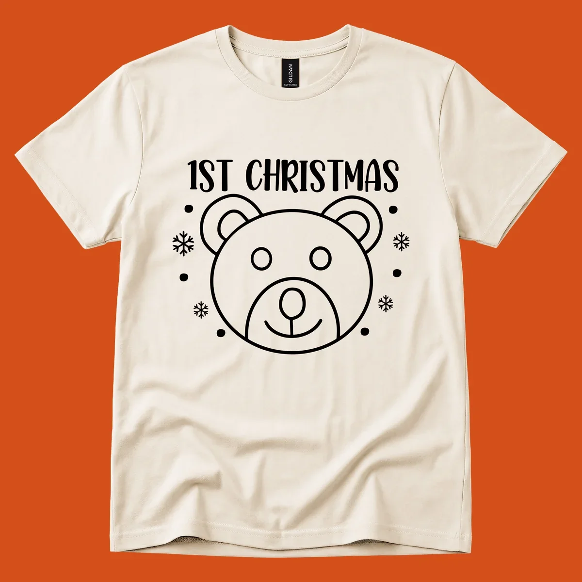 Baby's first christmas bear graphic with text and snowflakes.