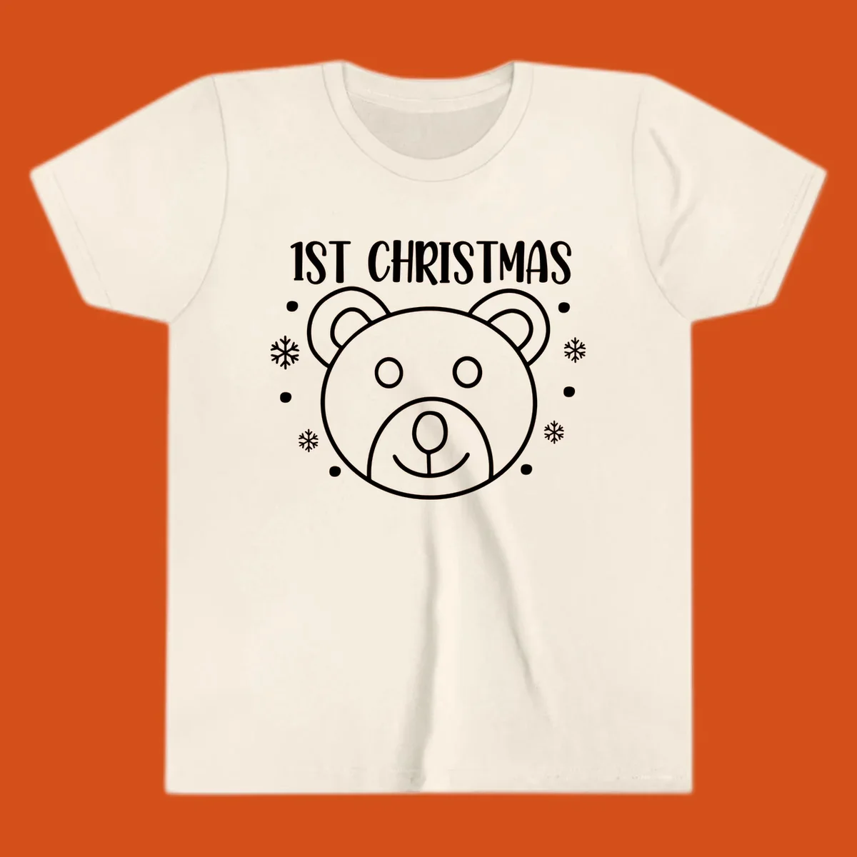 Baby's first christmas bear graphic with text and snowflakes.