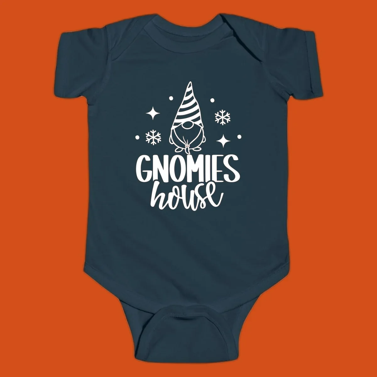 Illustration of a gnome with text 'GNOMIES house', surrounded by winter elements.