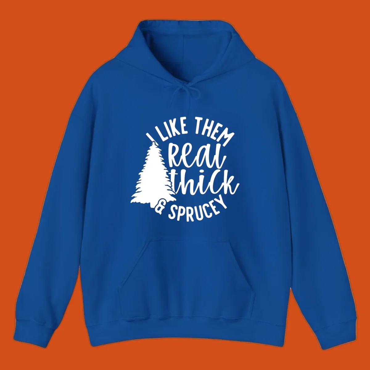 Illustration of a Christmas tree with text 'I like them real thick & sprucey', for thick-sprucey-christmas designs.