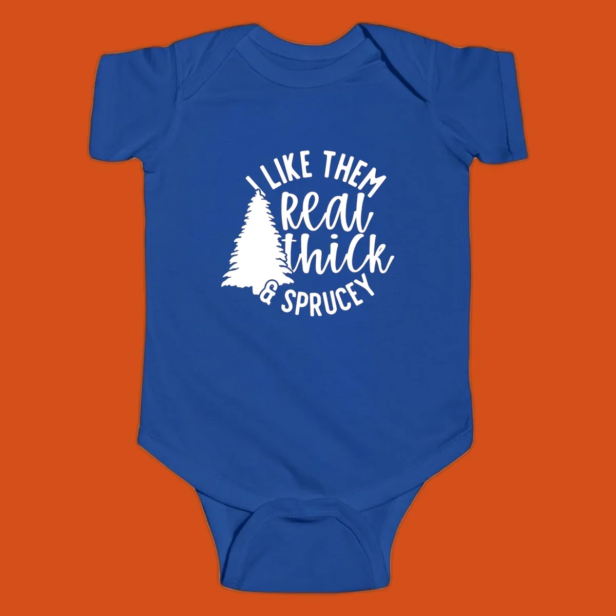 Illustration of a Christmas tree with text 'I like them real thick & sprucey', for thick-sprucey-christmas designs.