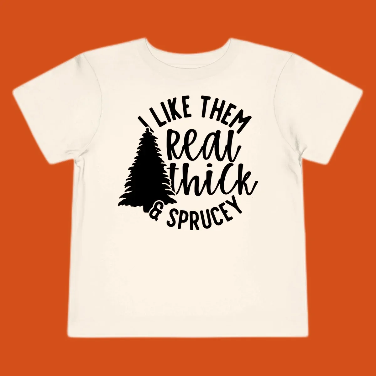 Illustration of a Christmas tree with text 'I like them real thick & sprucey', for thick-sprucey-christmas designs.