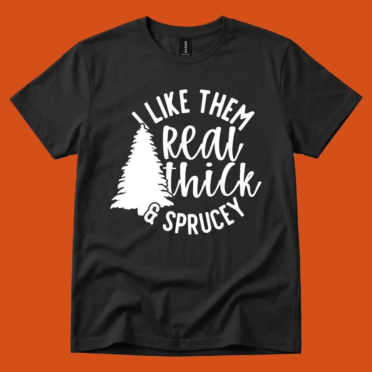 Illustration of a Christmas tree with text 'I like them real thick & sprucey', for thick-sprucey-christmas designs.