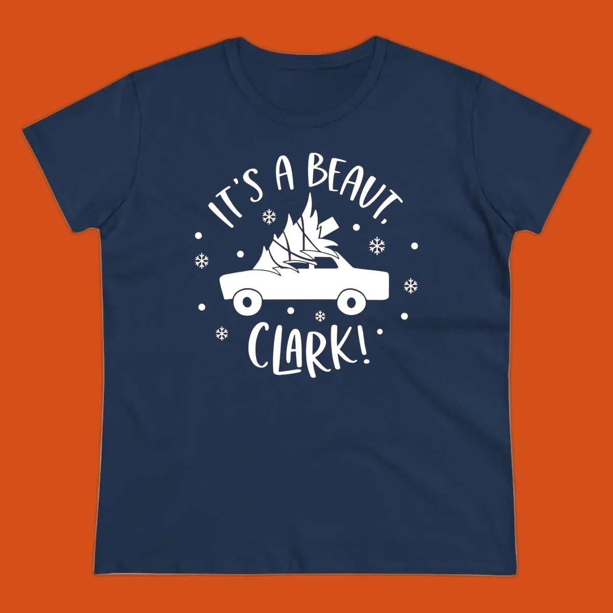 White silhouette of a car with a Christmas tree on top, and text 'IT'S A BEAUT, CLARK!'