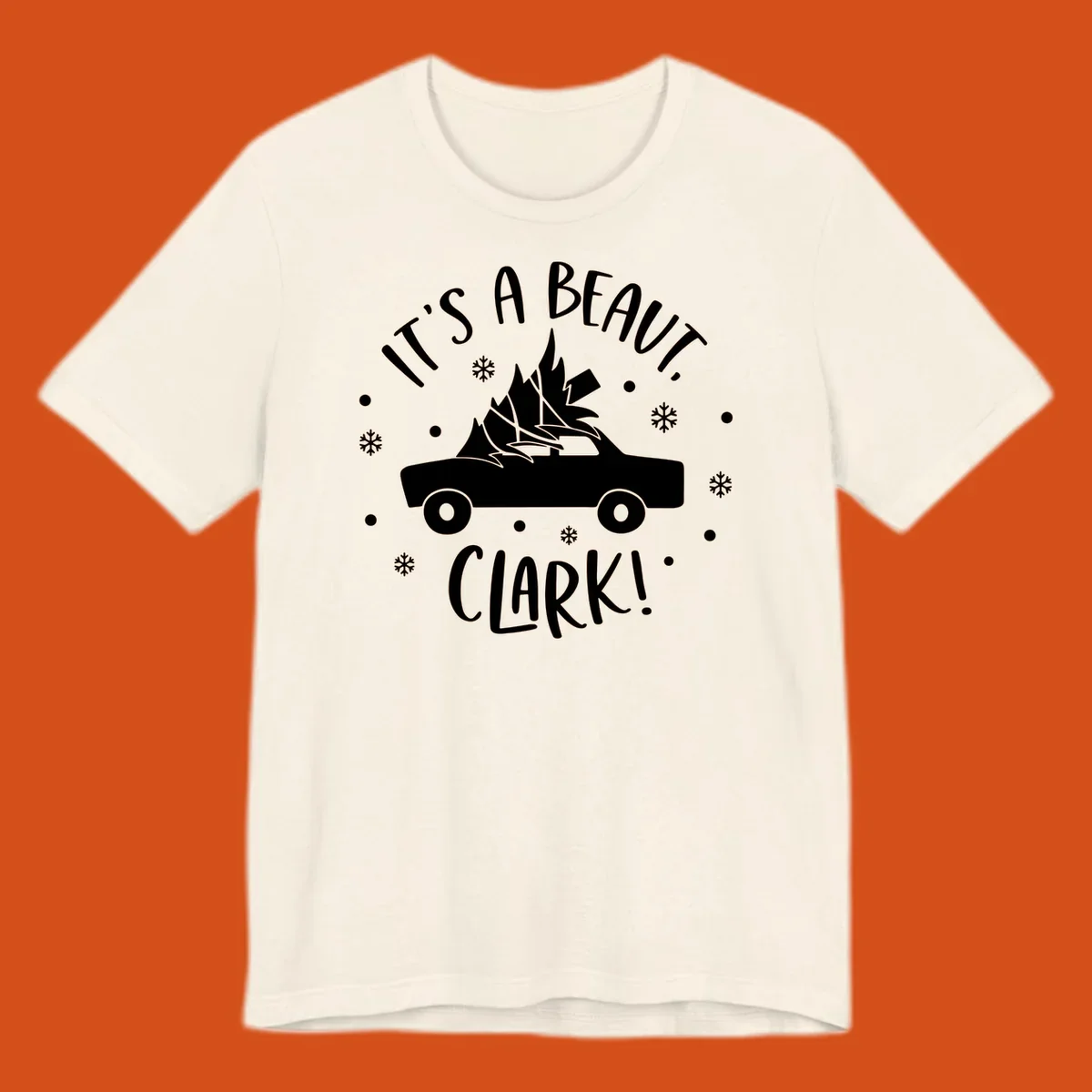 White silhouette of a car with a Christmas tree on top, and text 'IT'S A BEAUT, CLARK!'