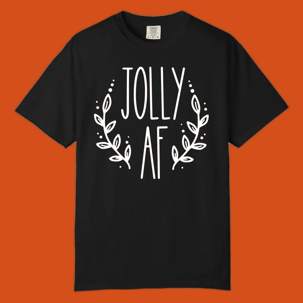Jolly AF Christmas wreath design with text and leaves.