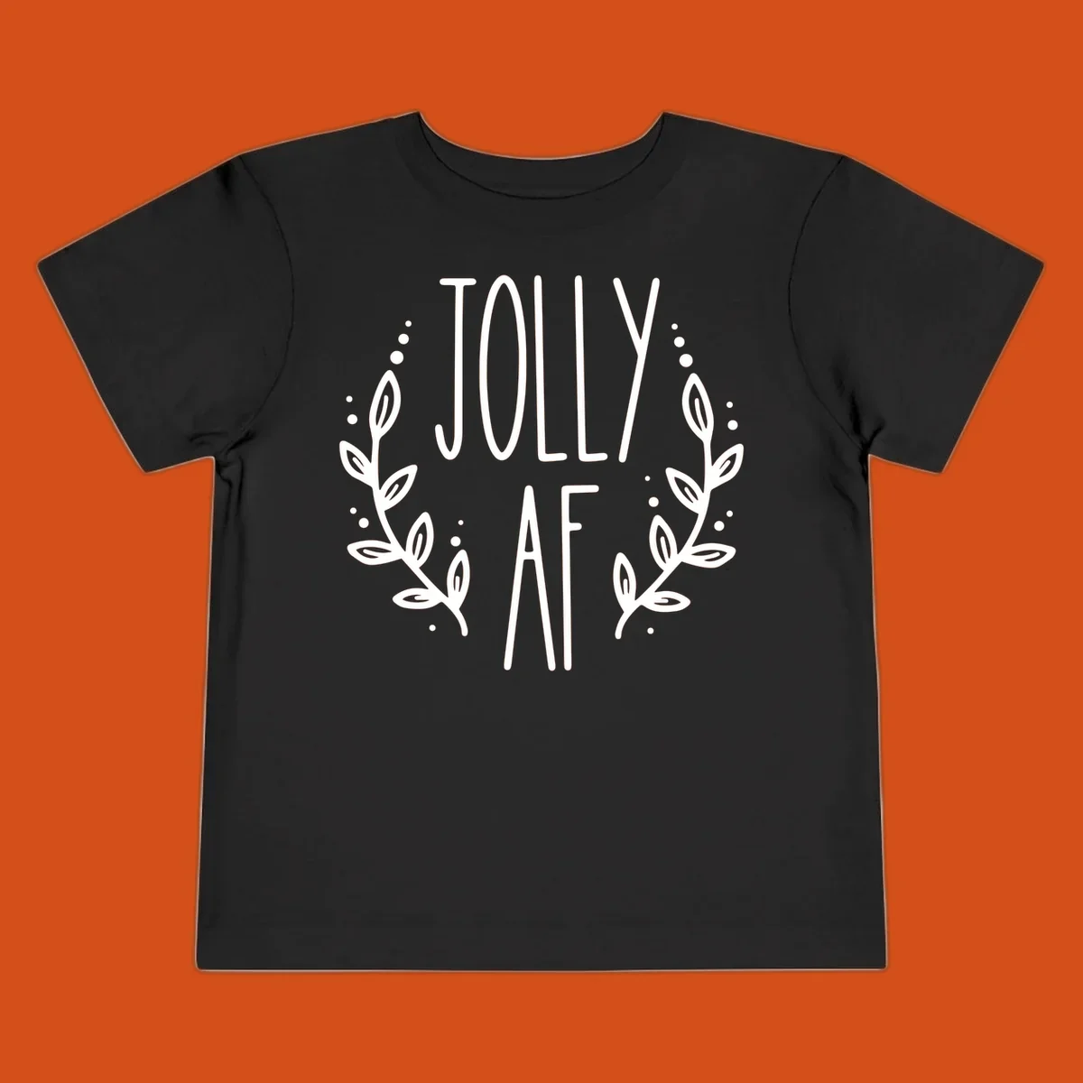 Jolly AF Christmas wreath design with text and leaves.